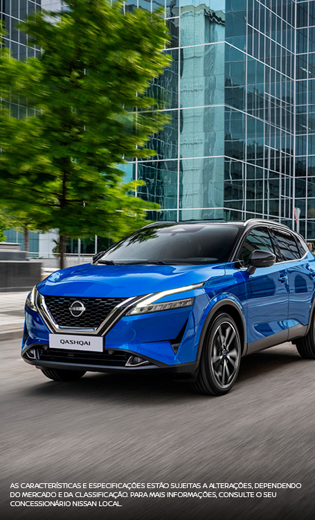 Blue Qashqai driving in street